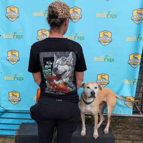 Woman and dog posing at the Dock Dogs event.